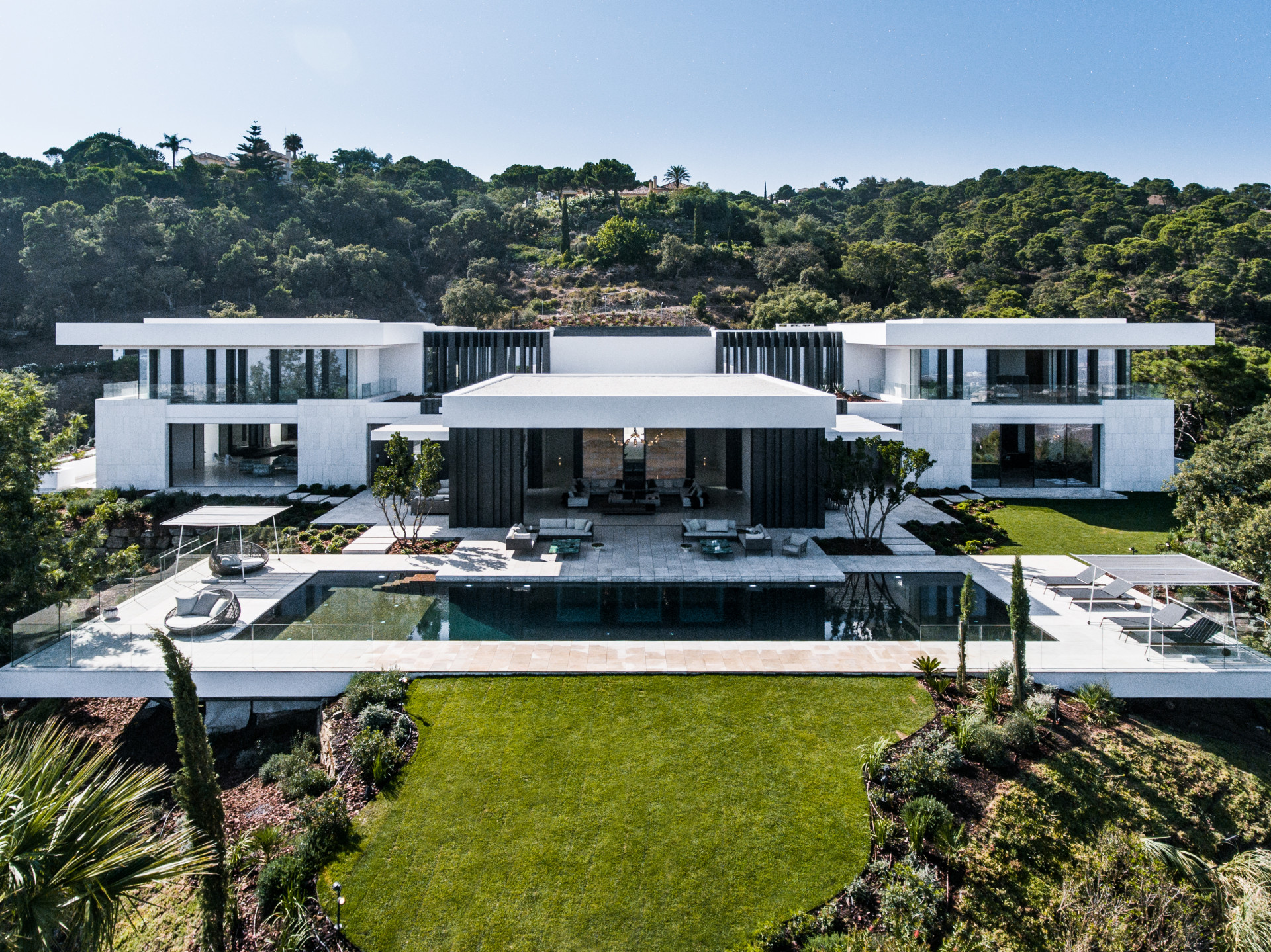 Modern white villa aerial view with pool