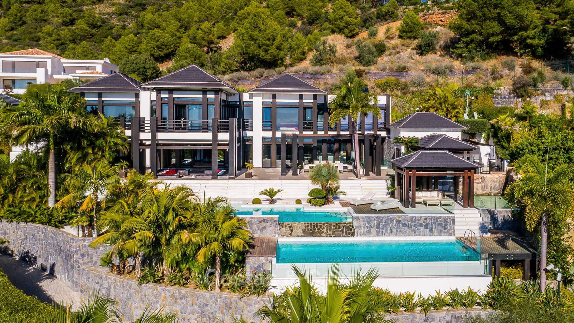 Tropical hillside villa aerial view