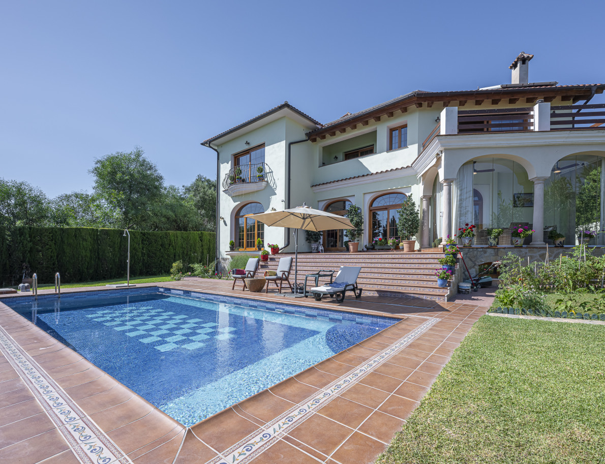 Traditional Andalusian villa at twilight with pool